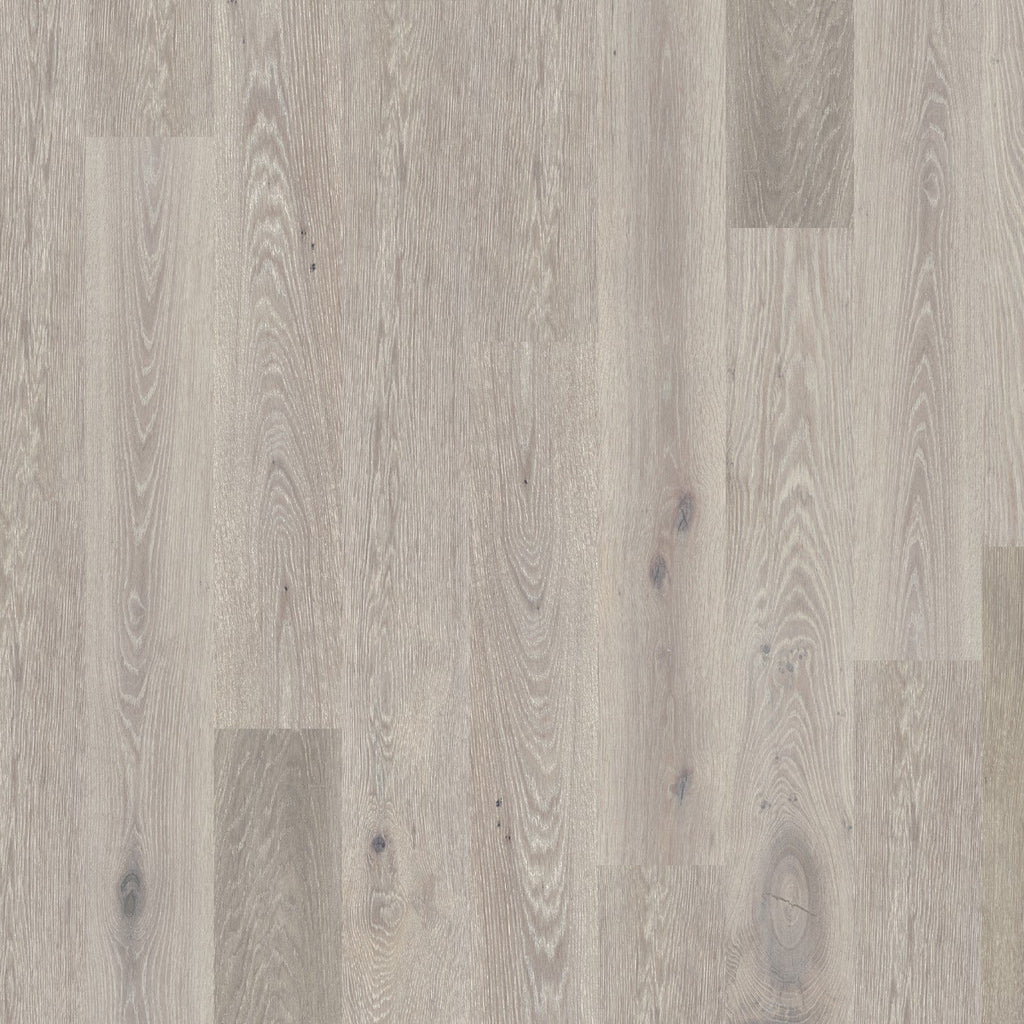 Close-up image of a Global Winds Collection Harmattan wood floor with a neutral mid-tone tan color and light blend of charcoal in the grain.